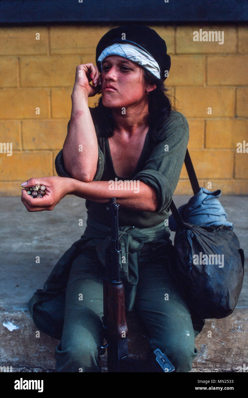 Managua, Nicaragua, June 1986; As a training exercise the Sandinista FSLN army sets up a mock US invasion of Managua. A young participant with her AK47. Stock Photo