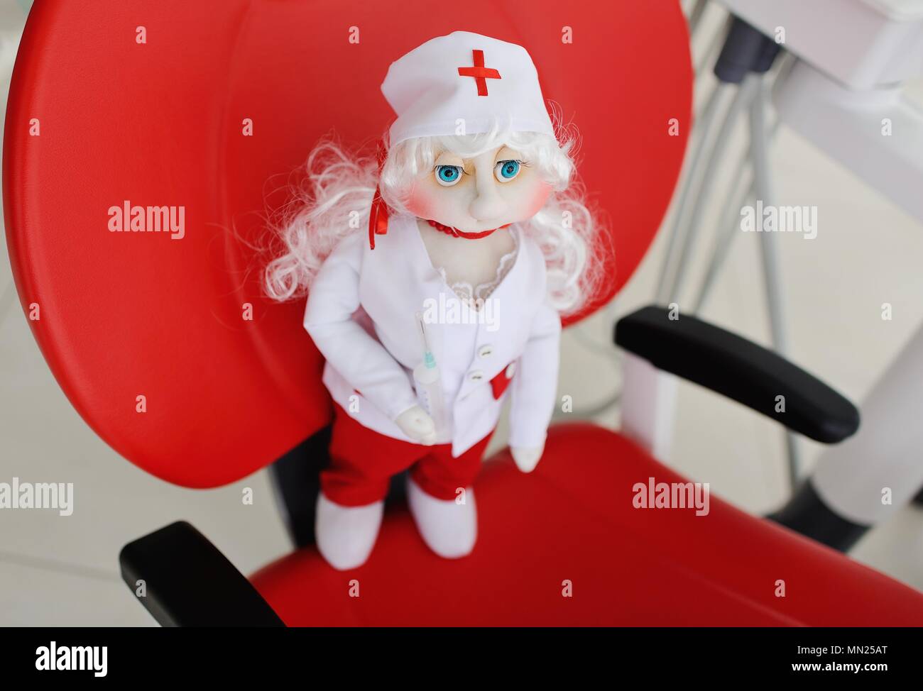Doll doctor in red dental chair Stock Photo Alamy