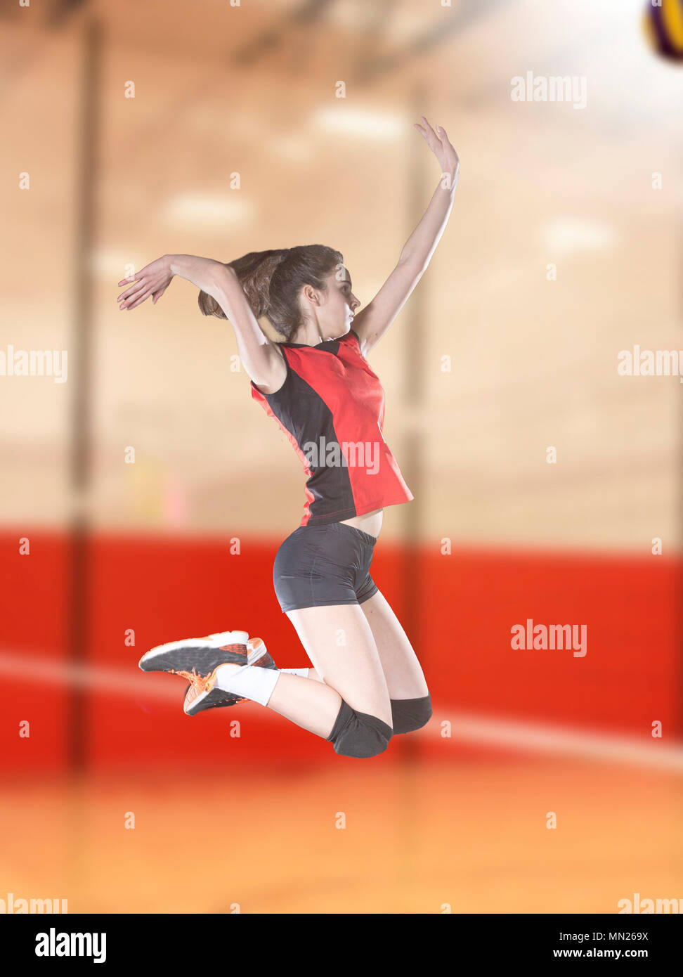 Female volleyball players jumping closeup on vollayball court Stock