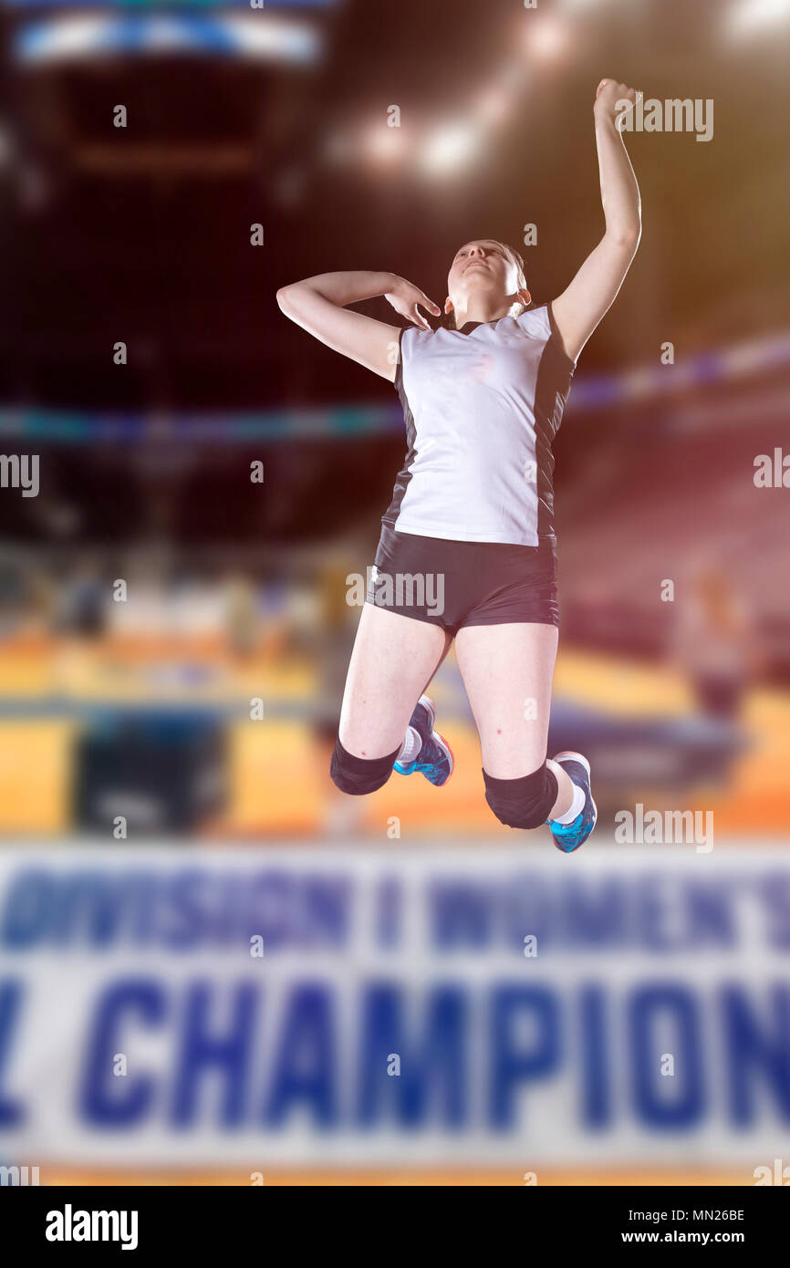 Female volleyball players jumping closeup on vollayball court Stock