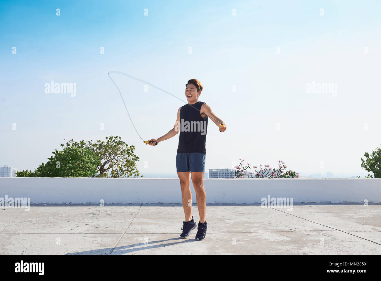 Man Using Jump Rope Model man exercising with jump-rope outdoors Stock Photo - Alamy