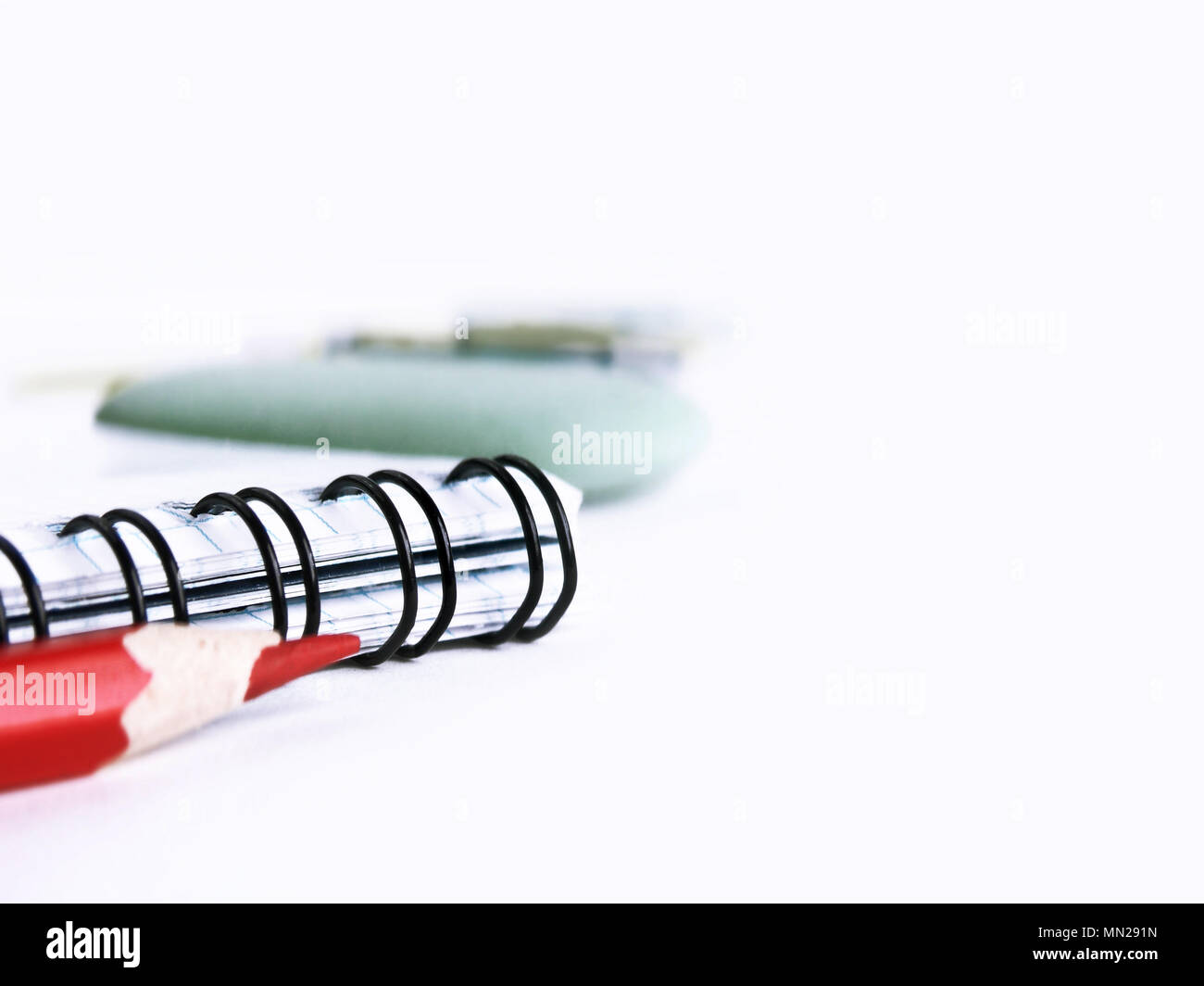 Notepad and red pencil on white background Stock Photo - Alamy