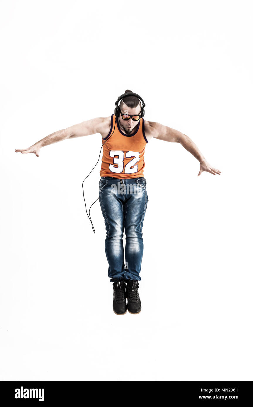 charming guy - rapper in headphones takes the dance break.photo on a ...