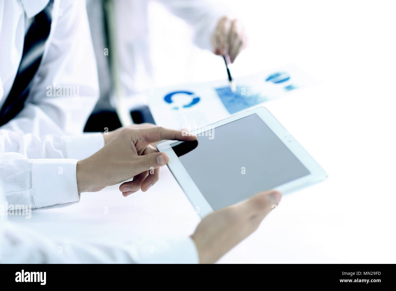 Image of human hand pointing in the touchscreen with business document ...