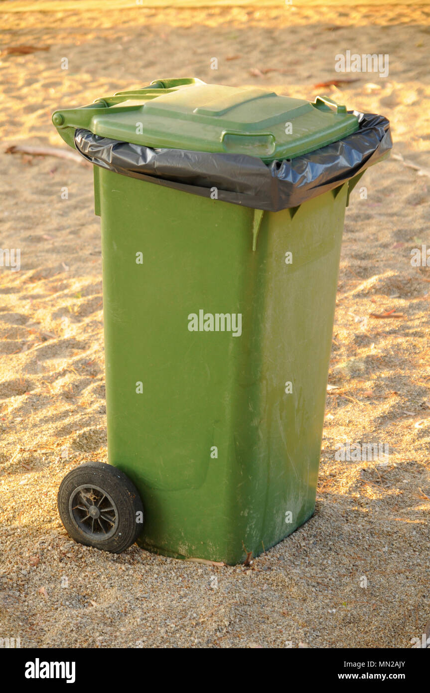 Green garbage bin protecting the environment Stock Photo