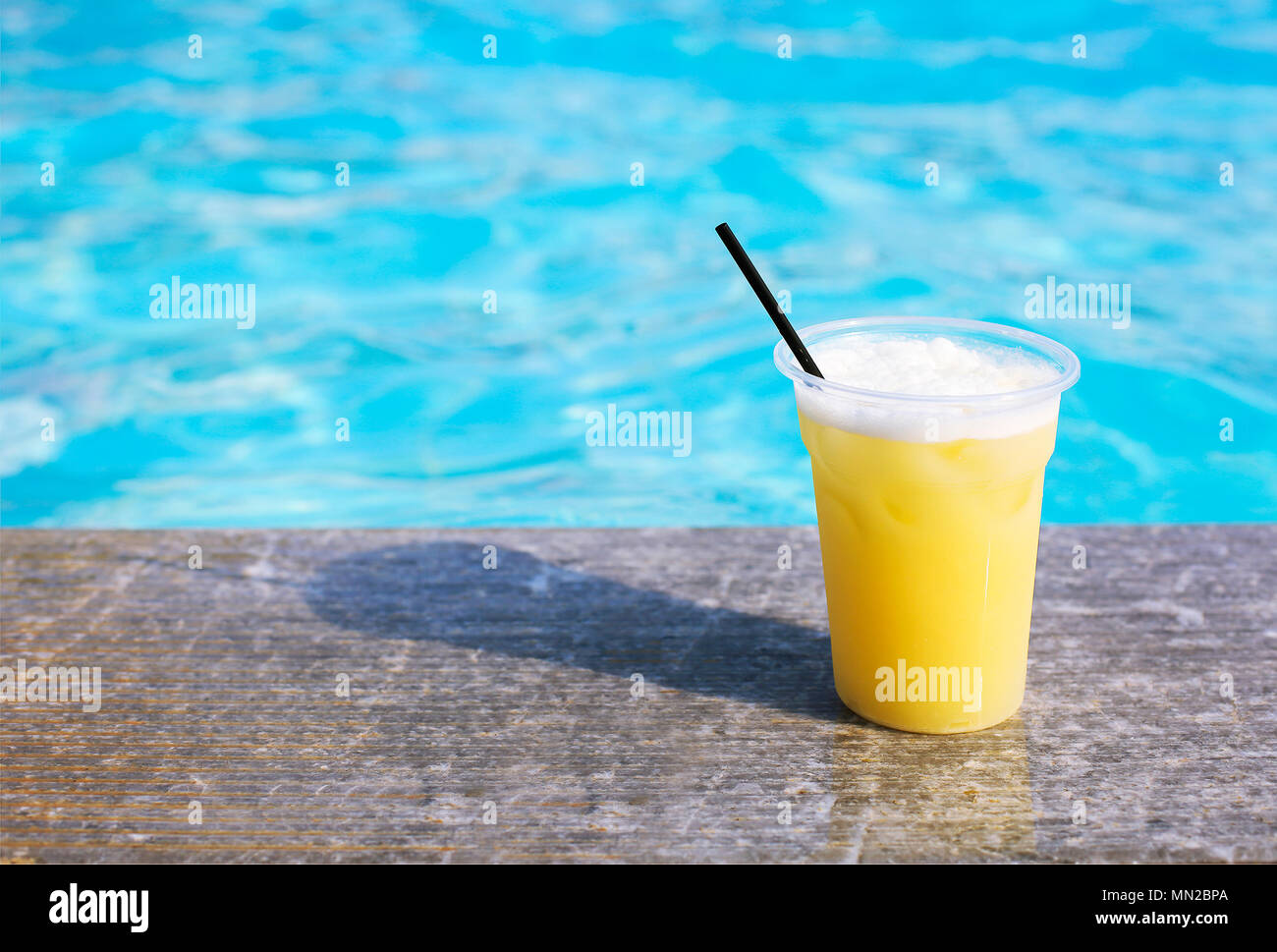 Glass Of Tropical Cocktail On Poolside Close Up Stock Photo Alamy