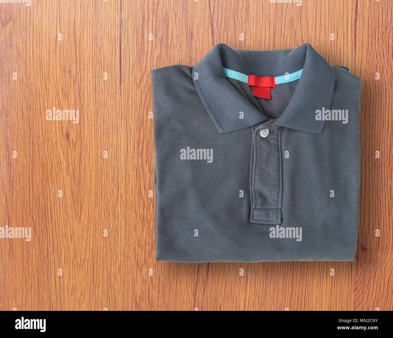Polo shirts put on white wooden table 