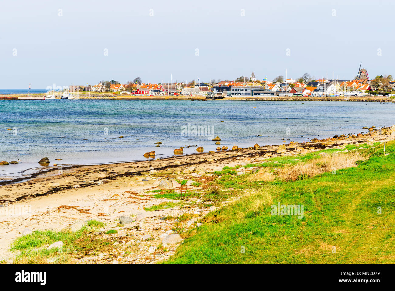 Viken, Sweden - April 30, 2018: Documentary of everyday life and place. The seaside village Viken seen from across the bay to the south on a sunny and Stock Photo