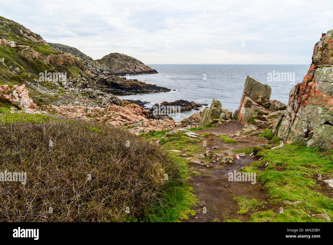 Western Kullaberg nature reserve, Sweden - The rocky landscape by the shore on a cloudy spring morning. Stock Photo