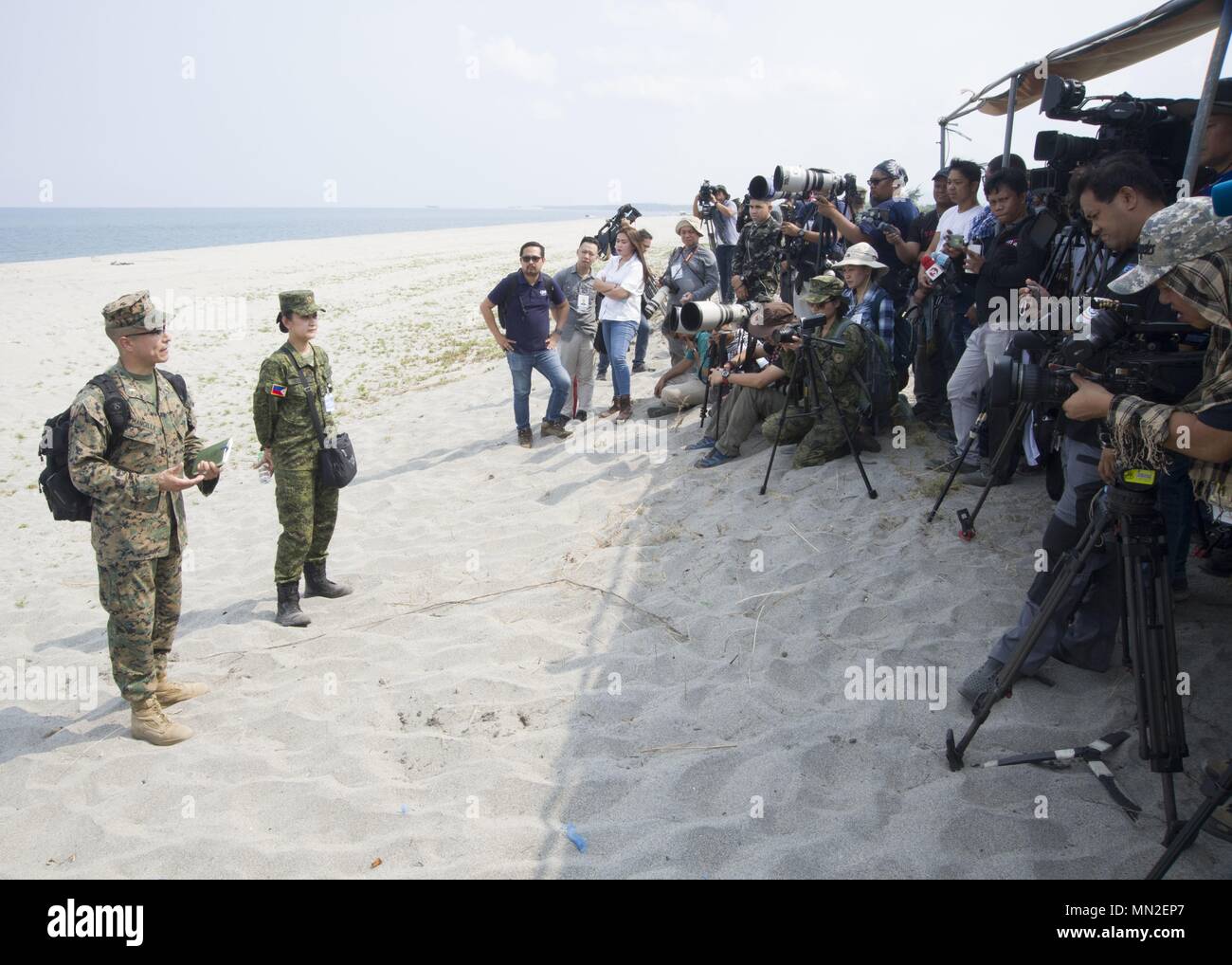 U.S. Marine Corps 1st Lt. David Mancilla, left, Communication Strategy and Operations Officer, III Marine Expeditionary Force and Philippine Navy Lt. Liezl M. Vidallon, left-center, Exercise Balikatan combined joint information bureau co-director, answer questions from the media prior to the start of the amphibious exercise (AMPHIBEX) at the Naval Education and Training Command, Naval Station Leovigildo Gantioqui, San Antonio, Zambales, Philippines May 9, 2018, May 9, 2018. Exercise Balikatan, in its 34th iteration, is an annual U.S.-Philippine military training focused on a variety of mission Stock Photo