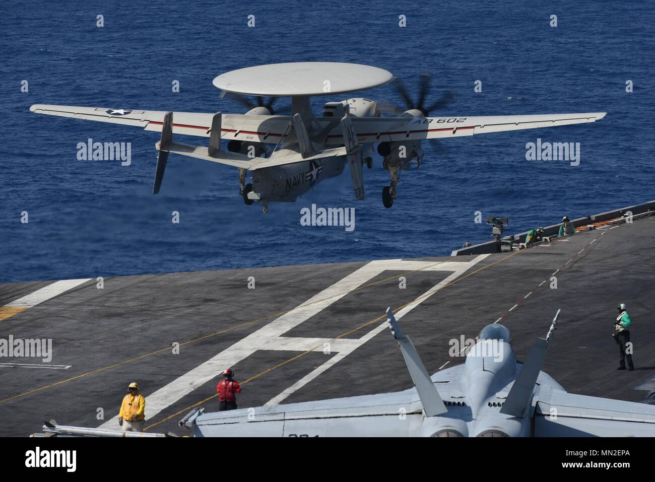 180509-N-ZH683-0210 MEDITERRANEAN SEA (May 9, 2018) An E-2D Hawkeye, assigned to the 'Seahawks' of Carrier Airborne Early Warning Squadron (VAW) 126, launches from the flight deck aboard USS Harry S. Truman (CVN 75), May 9, 2018. As the Carrier Strike Group 8 flag ship, Truman's support of Operation Inherent Resolve demonstrates the capability and flexibility of U.S. Naval Forces, and its resolve to eliminate the terrorist group ISIS and the threat it poses. (U.S. Navy photo by Mass Communication Specialist 3rd Class Juan Sotolongo/Released). () Stock Photo
