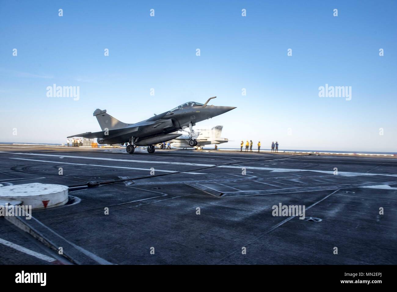 180510-N-UV609-0540 ATLANTIC OCEAN (May 10, 2018) A Rafale Marine attached to squadron 17F of the French navy lands on the flight deck of the aircraft carrier USS George H.W. Bush (CVN 77), May 10, 2018. GHWB is underway in the Atlantic Ocean conducting carrier air wing exercises with the French navy to strengthen partnerships and deepen interoperability between the two nations' naval forces. (U.S. Navy photo by Mass Communication Specialist 2nd Class David Mora Jr.). () Stock Photo