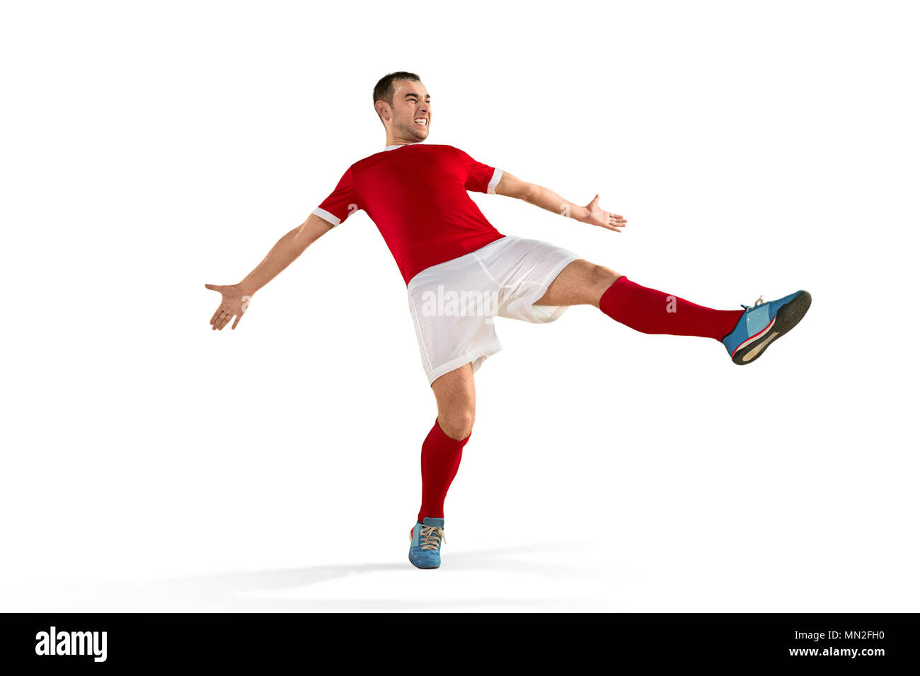 Professional football soccer player in motion isolated white studio