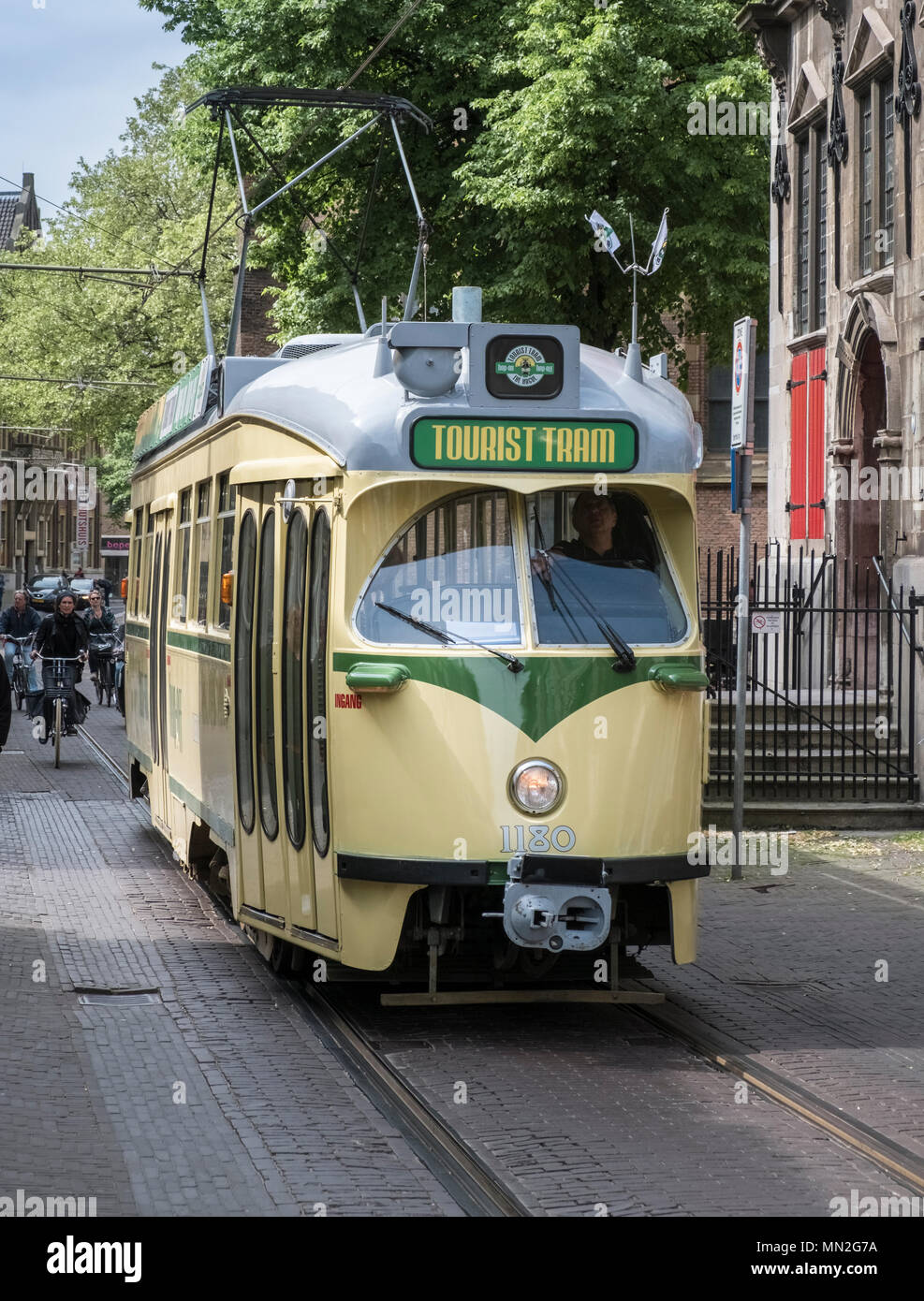 Hop on, hop off, tourist tram transport outside the Grote Kerk, The Hague (Den Haag), Netherlands. Stock Photo