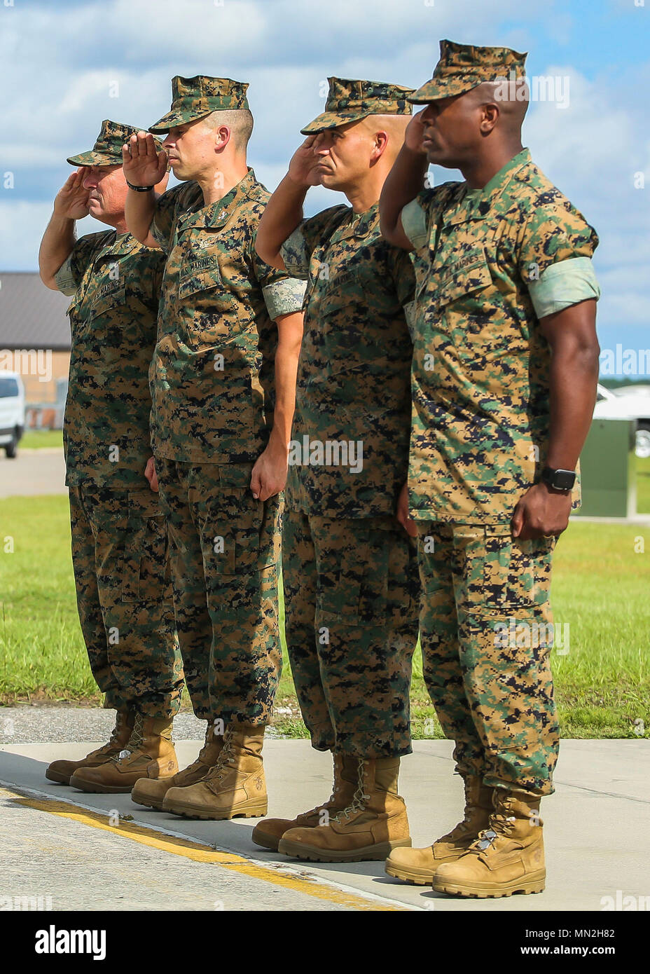 From left to right: Brig. Gen. Austin E. Renforth, Col. Timothy P. Miller, Sgt. Maj. Rafael Rodriguez, and Sgt. Maj. Derrick N. Mays salute as Secretary of the Navy, Richard V. Spencer lands aboard Marine Corps Air Station Beaufort, Aug. 10. During his visit, Spencer visited Marine Corps Recruit Depot Parris Island, attended a recruit graduation, visited Marine Aircraft Group 31 and Marine Fighter Attack Training Squadron 501 to learn about the F-35B. Spencer was sworn into office Aug. 3, 2017.  Renforth is the commanding general of Marine Corps Recruit Depot Parris Island and Eastern Recruiti Stock Photo