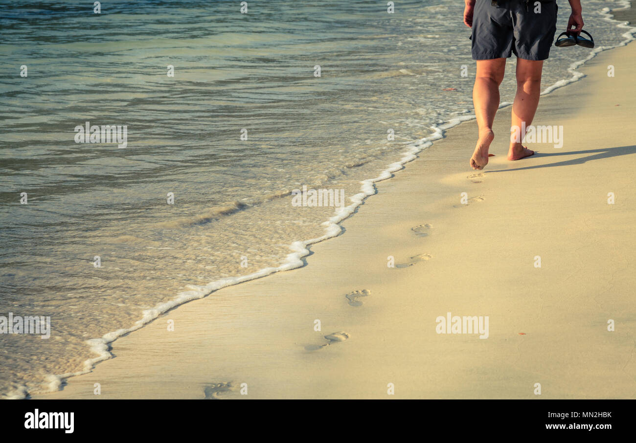 Walking barefoot along beach hi-res stock photography and images - Alamy
