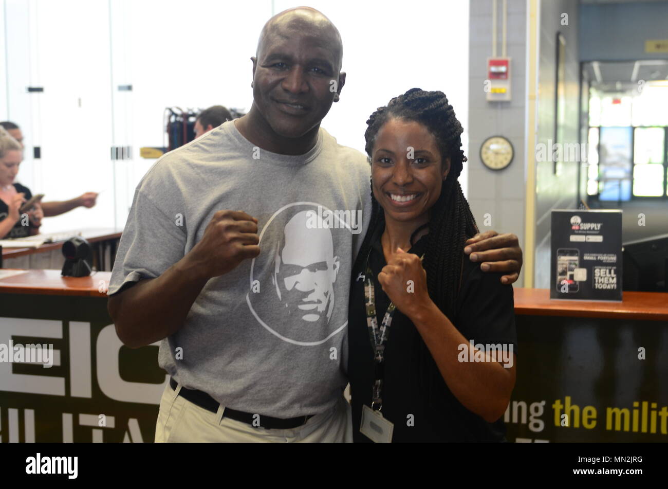 Devin Bradley, a coordinator for Newman Gym, poses with former professional boxer, Evander Holyfield, at Newman Gym Aug. 18 at Fort Stewart, Georgia during Holyfield's tour of the facility and visit with 3rd Infantry Division Soldiers . Stock Photo