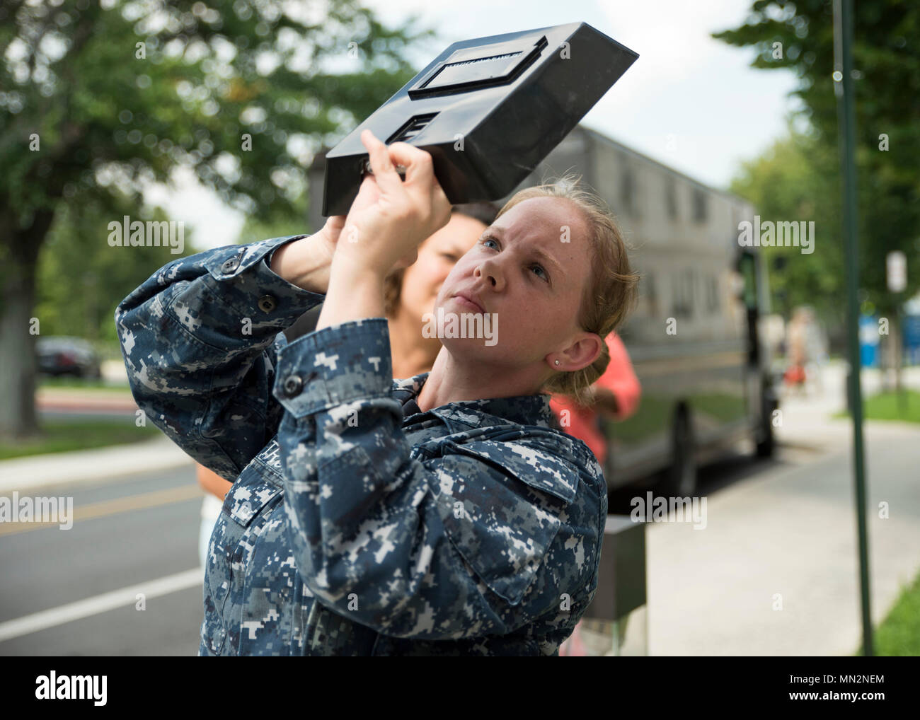 Hospital Corpsman 3rd Class Ashley Lindstrom observes the solar eclipse ...