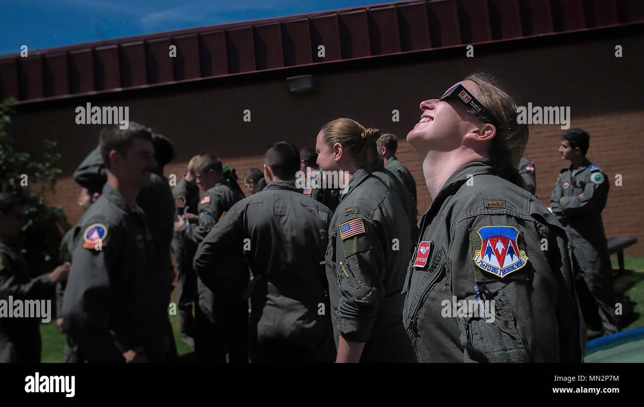 2nd Lt. Katie Rettinger, an Air Force Specialized Undergraduate Pilot Training Class 18-10 student, and classmates escaped their instructor pilots for a bit to check out the solar eclipse at Vance Air Force Base, Oklahoma, Aug. 21. (U.S. Air Force photo by David Poe) Stock Photo