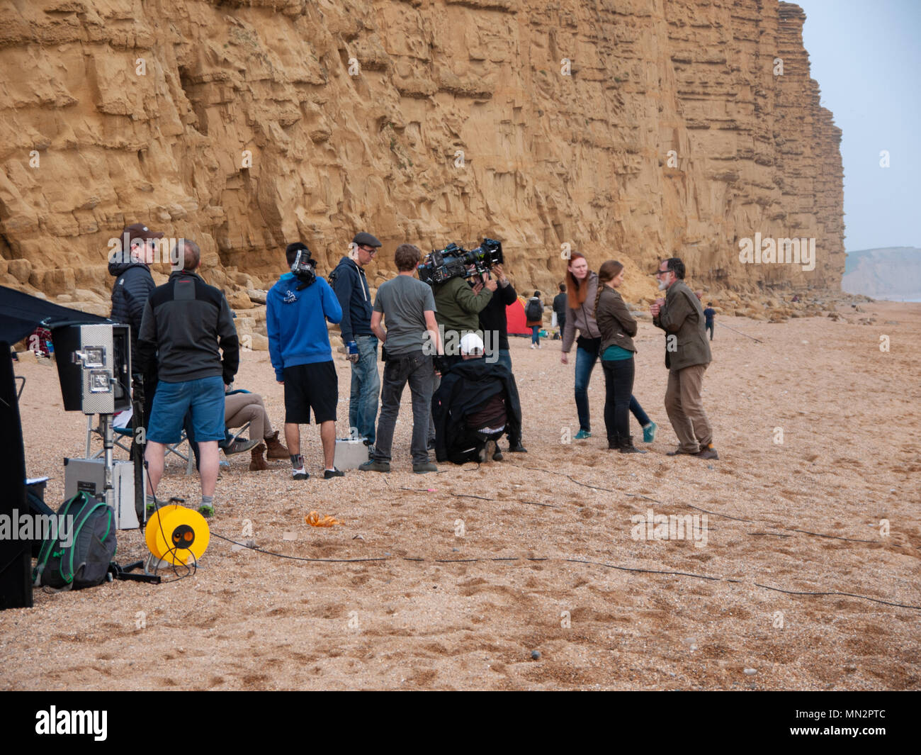 Film / Movie production on West Bay beach, Dorset, UK Stock Photo