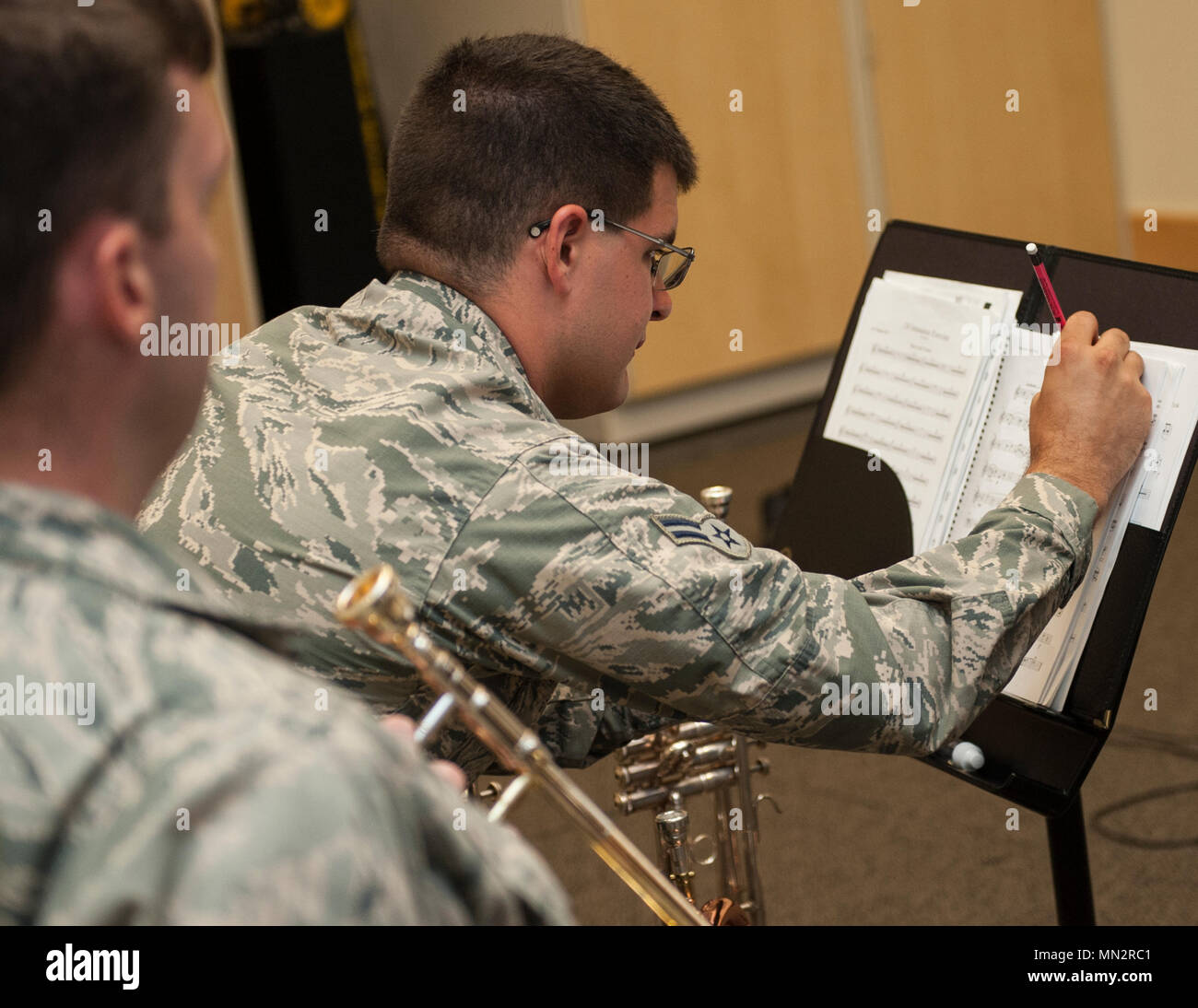 U S Air Force Airman First Class Alan Matteri A Trumpet Player For The United States Air Force Band Of The Golden West Jots Down A Note On A Sheet Of Music alamy