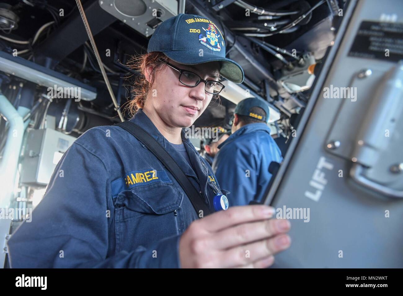 170822-N-GX781-191 SKAGERRAK STRAIT (Aug. 22, 2017) - Ensign Paris Bess, from Troy, Ohio, scans the horizon with binoculars aboard the Arleigh Burke-class guided-missile destroyer USS James E. Williams (DDG 95) as the ship transits the Skagerrak Strait Aug. 22, 2017.  James E. Williams, home-ported in Norfolk, is on a routine deployment to the U.S. 6th Fleet area of operations in support of U.S. national security interests in Europe. (U.S. Navy photo by Mass Communication Specialist 3rd Class Colbey Livingston/ Released) Stock Photo