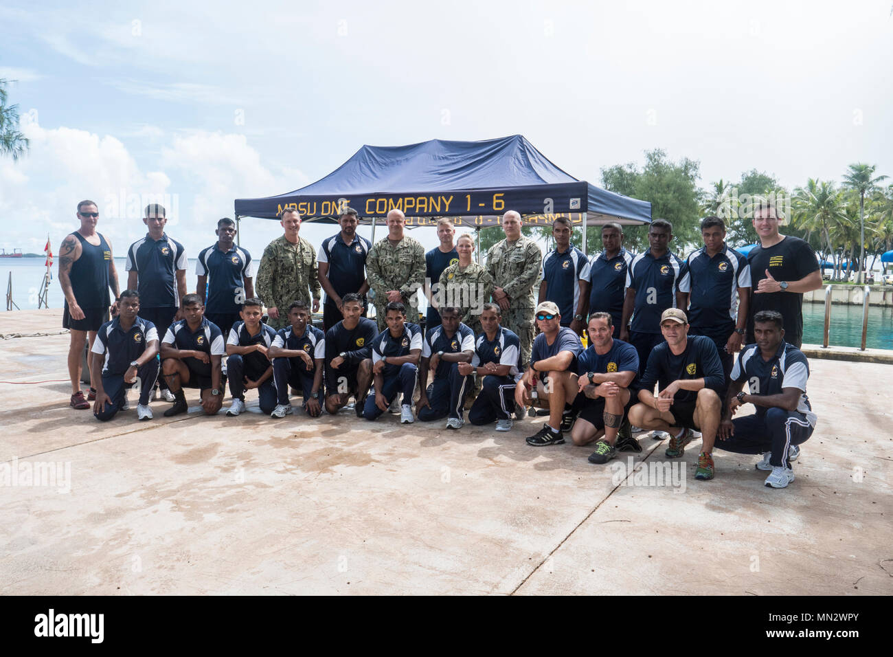 Service members assigned to Mobile Diving Salvage Unit One (MDSU 1), Commander, Task Force (CTF) 75,  and Sri Lanka Navy (SLN) pose for a group photo during a Diving Subject Matter Expert Exchange (SMEE) at Naval Base Guam, Aug. 16, 2017. MDSU 1 conducts SMEEs to strengthen the relationship and understanding between SLN and USN Divers through surface-supplied and SCUBA diving operations. (U.S. Navy Combat Camera photo by Mass Communication Specialist 1st Class Arthurgwain L. Marquez) Stock Photo
