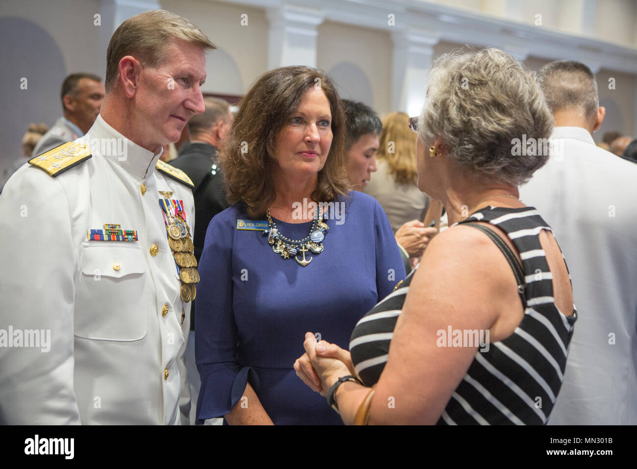 Walter E. Carter Jr. (born 1956) is a United States Navy vice admiral and  former superintendent of the United States Naval Academy. The archival  image records him speaking with guests during an