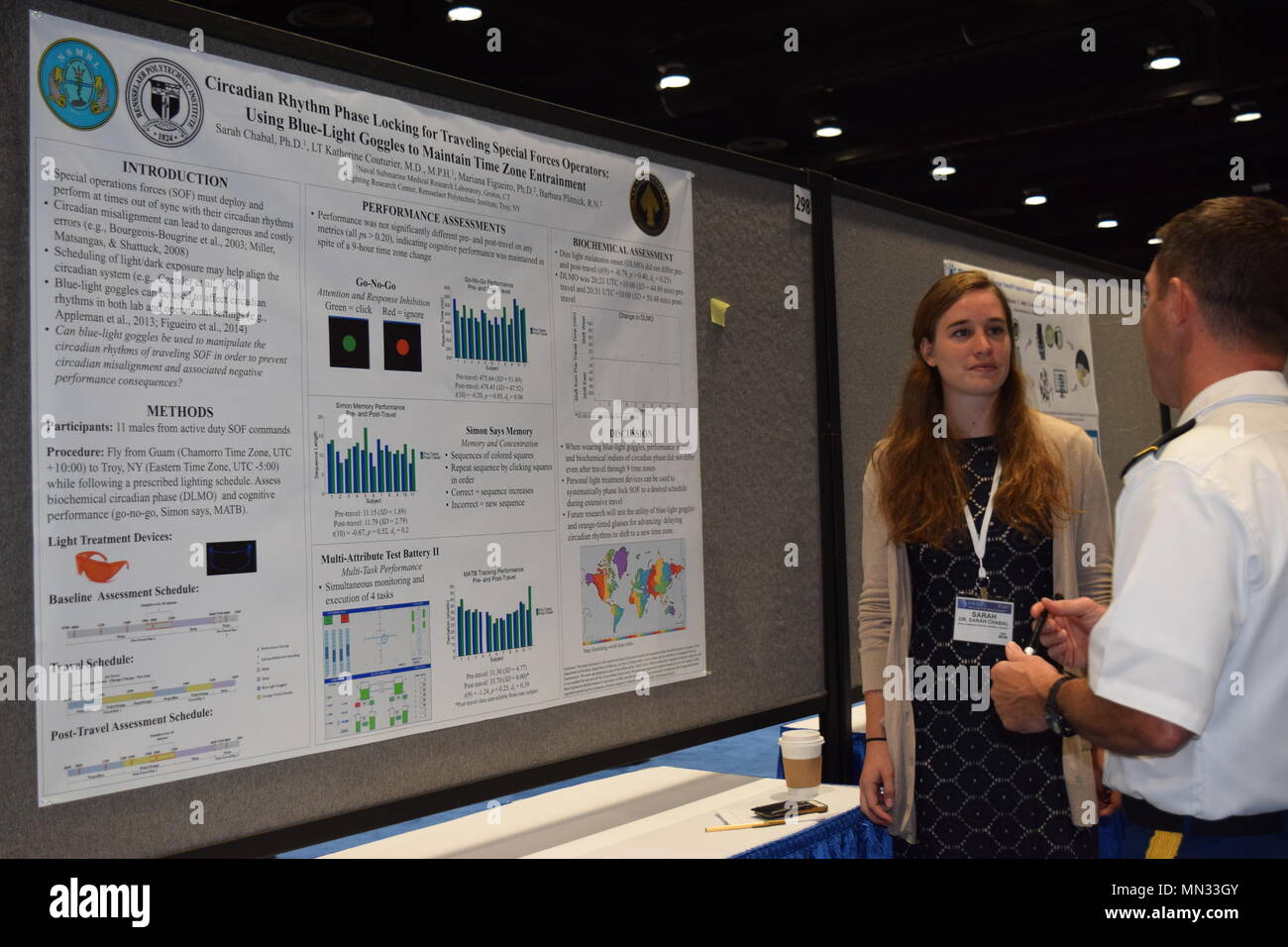 Dr. Sarah Chabal, Warfighter Performance Directorate, Naval Submarine Medical Research Laboratory in Groton, Connecticut speaks to a Military Health System Research Symposium (MHSRS) attendee, August 28, Kissimmee, Florida. (U.S. Navy Photo/Katie Berland/Released) Stock Photo