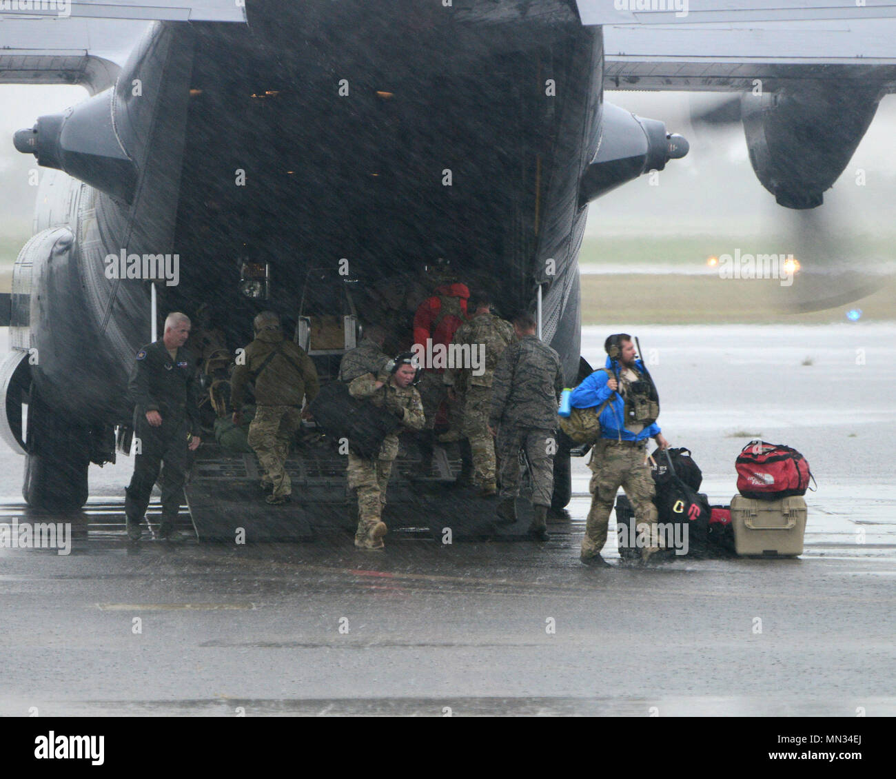 Col. Robert Belwood (left), 147th Attack Wing Operations Group Commander, assist as a C130