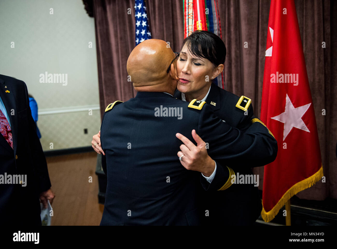 Brig. Gen. Irene Zoppi, U.S. Army Reserve deputy commanding general for the 200th Military Police Command, hugs Maj. Gen. (Ret.) Luis Visot, former chief of staff of the U.S. Army Reserve, after her promotion ceremony held on Fort Meade, Maryland, Aug. 28, 2017. During her ceremony, Zoppi expressed pride in her Latin American and Puerto Rican heritage, and she spoke about how her upbringing and culture brought passion and compassion to her military career and leadership style. As the deputy commanding general of support, Zoppi will be supporting Maj. Gen. Marion Garcia who is the commanding ge Stock Photo