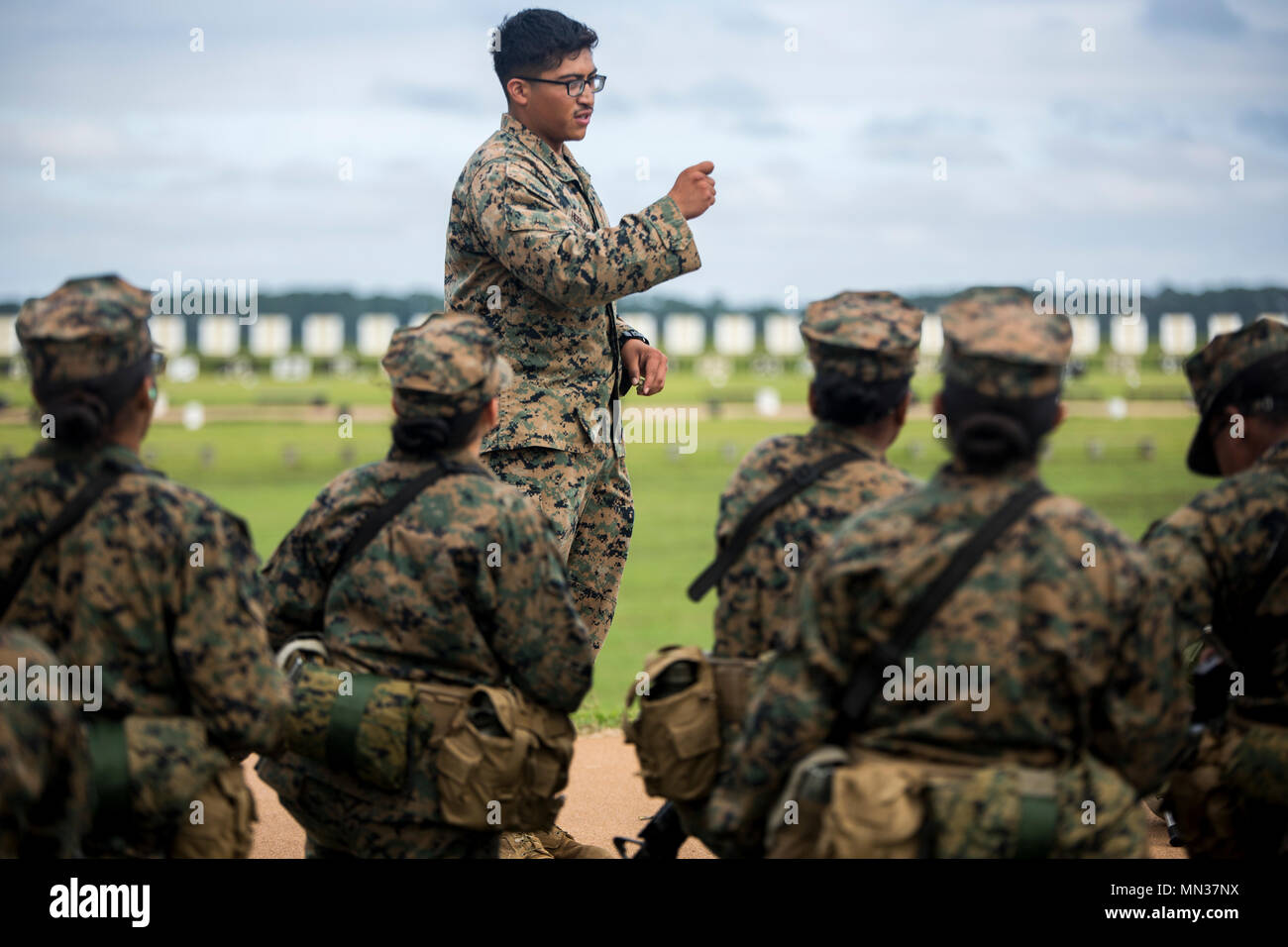 U.S. Marine Corps Lance Cpl. Fernando Hernandez, a marksmanship coach ...