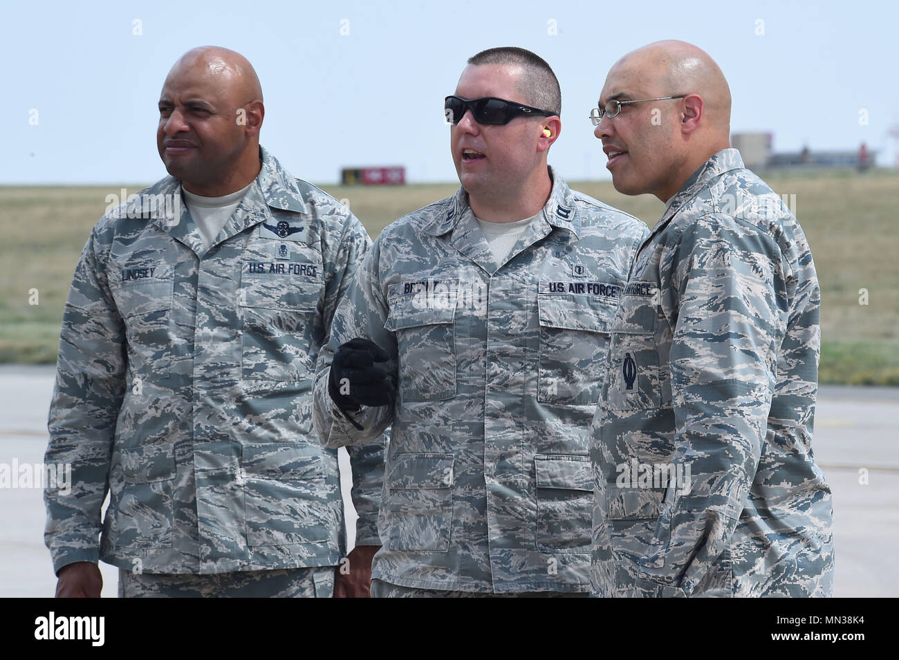 Col. David Miller Jr., 460th Space Wing commander, and Chief Master Sgt. Rodney Lindsey, 460th Space Wing command chief, visit the flight line on Buckley Air Force Base, Colo., in order to give encouragement to the men and women prepping aircraft that will bring supplies to those in need after Hurricane Harvey Aug. 30, 2017. Medical supplies were loaded into two C-17’s from the 105th Airlift Wing out of Stewart National Guard Base in New York, that will help those affected by Harvey. (U.S. Air Force photo by Senior Airman Luke W. Nowakowski/Released) Stock Photo