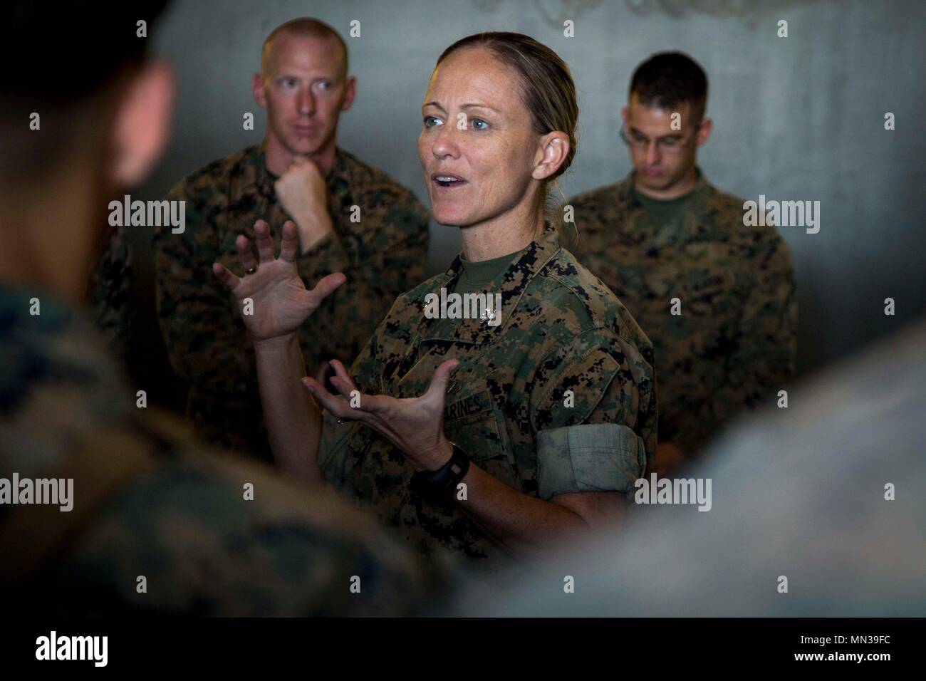 U.S. Marine Corps Col. Maura Hennigan, Commanding Officer for Combat Logistics Regiment-3, talks to Marines attached to Task Force Koa Moana 17 aboard the USNS Sacagawea, off the coast of Australia, Aug. 31, 2017.  Koa Moana 17 is designed to improve interoperability with our partners, enhance military-to-military relations, and expose the Marine Corps forces to different types of terrain for familiarity in the event of a natural disaster in the region.   (U.S. Marine Corps photo by MCIPAC Combat Camera Lance Cpl. Juan C. Bustos) Stock Photo