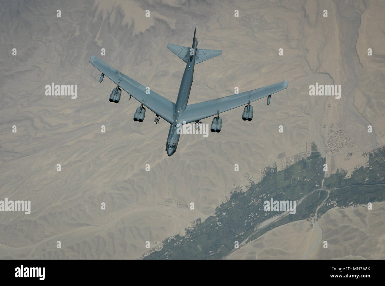 A U.S. Air Force B-52 Stratofortress flies above Southwest Asia Aug. 28, 2017. Despite being in the Air Force inventory for more than 50 years, B-52s continue to provide precision-guided weapons capabilities to Operation Inherent Resolve. The aircraft's payload capacity of 70,000 pounds can include gravity bombs, cluster bombs, precision-guided missiles and Joint Direct Attack Munitions. (U.S. Air Force photo by Staff Sgt. Michael Battles) Stock Photo