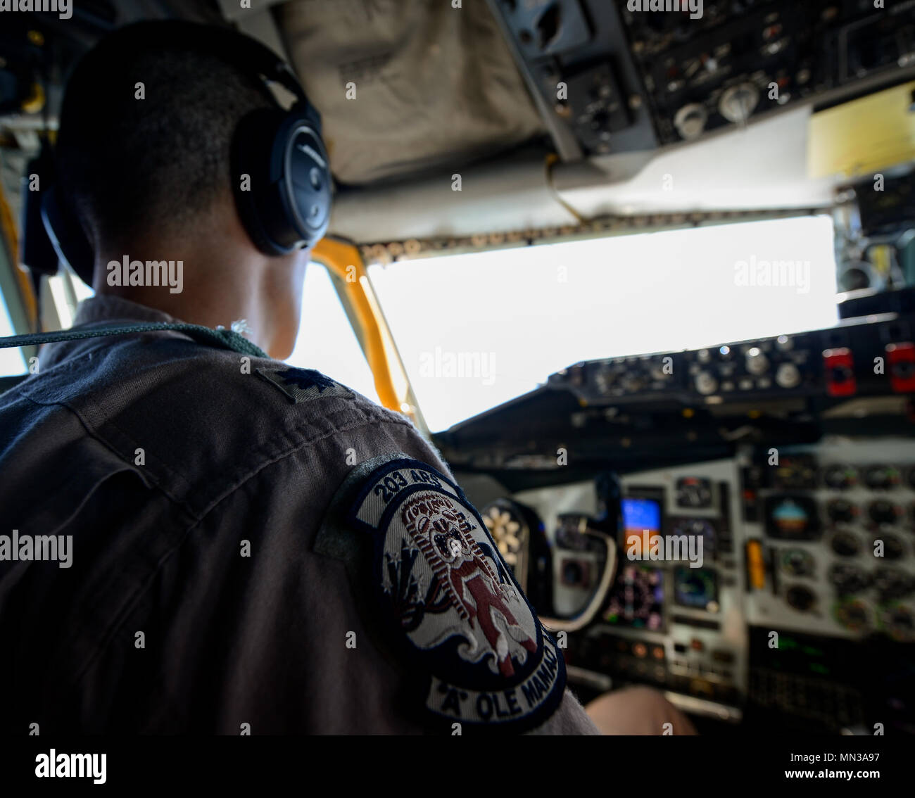 A military patch adorns the uniform of a KC-135 Stratotanker pilot during a flight in support of Operation Inherent Resolve Aug. 28, 2017. Despite being in the Air Force inventory for more than 50 years, B-52s can drop precision-guided weapons. The aircraft's payload capacity of 70,000 pounds can include gravity bombs, cluster bombs, precision-guided missiles and Joint Direct Attack Munitions. (U.S. Air Force photo by Staff Sgt. Michael Battles) Stock Photo