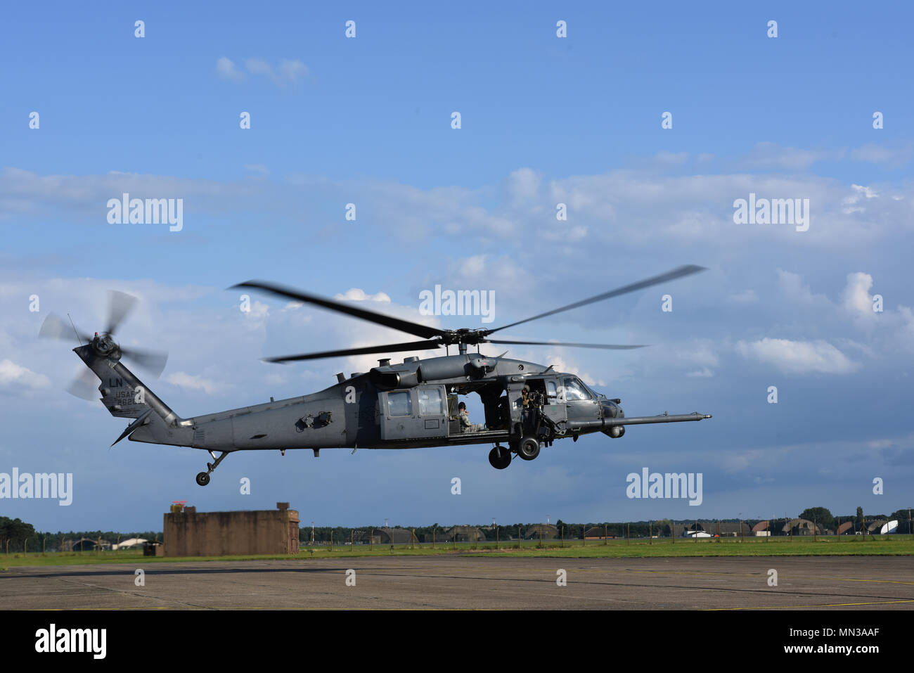 An HH-60G Pave Hawk assigned to the 56th Rescue Squadron performs a hover test prior to taking off at Royal Air Force Lakenheath, England, Aug. 31. The Pave Hawks of the 56th RQS provide RAF Lakenheath with day or night personnel recovery capabilities. (U.S. Air Force photo/Airman 1st Class Eli Chevalier) Stock Photo