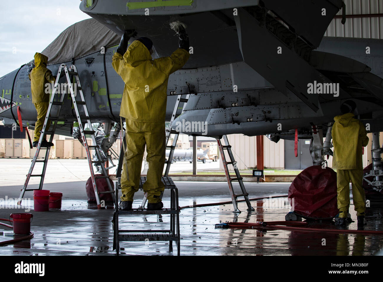 Members of the 23d Aircraft Maintenance Squadron scrub an A10C