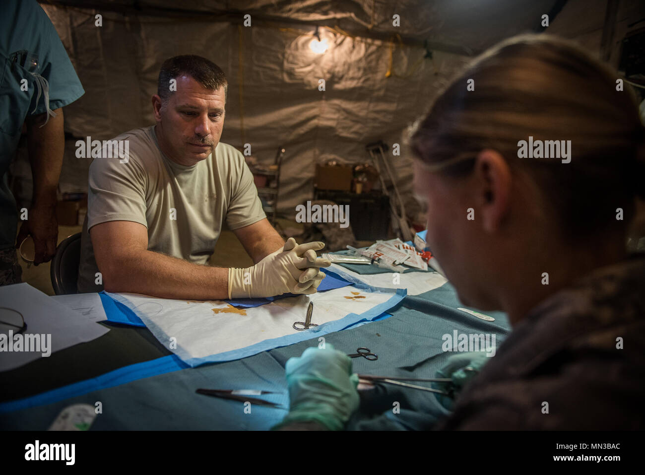 Maj. Todd Dean, 932nd Airlift Wing nurse ,looks on as medical