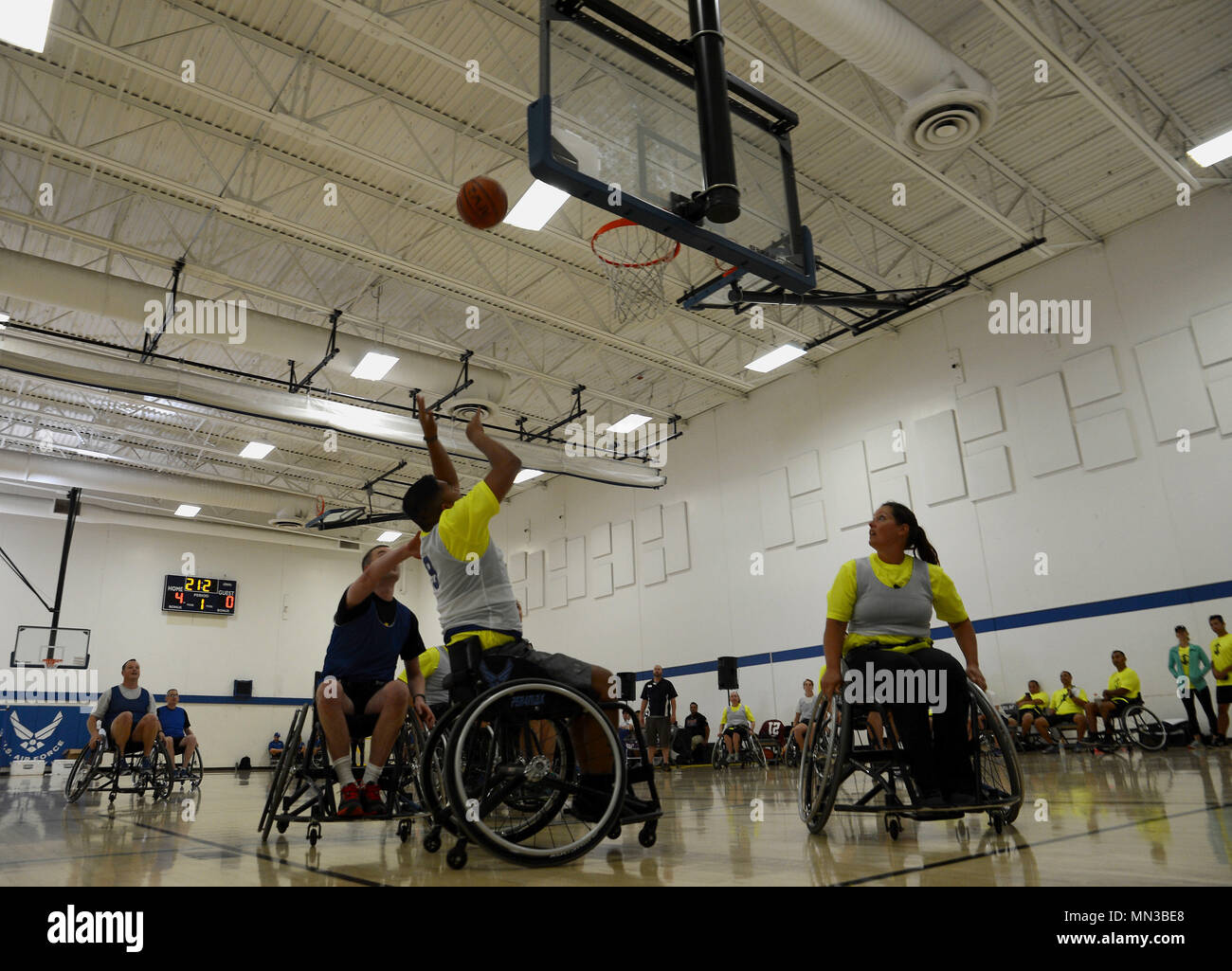Participants of the Air force Wounded Warrior Program, play wheelchair basketball during the 2017 Joint Adaptive Sports Camp Aug. 29, 2017, at Joint Base Lewis-McChord, Wash. During Aug. 28-31, JBLM supported the 2017 JASC management team as they hosted a joint services camp at Cowan and Memorial Stadiums, and at other athletic venues across the installation. Cowan Stadium and Memorial Field was setup for all track and field events. The Directorate of Family and Morale, Welfare and Recreation tent was used for archery and shooting events, and Soldier’s Field House was used for swimming events. Stock Photo