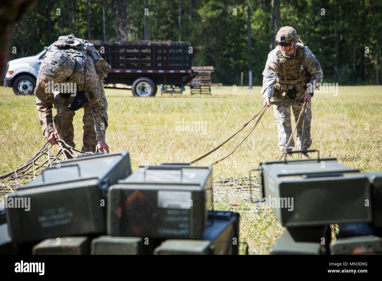 during the Ordnance Crucible at Fort Pickett, Va., Aug. 9, 2017. The U.S. Army Ordnance Crucible is a three-part competition, comprised of the Ammunition Transfer Holding Point, Combat Repair Team, and Explosive Ordnance Disposal, which is designed to test Soldiers’ teamwork and critical thinking skills. (U.S. Army photo by Spc. Abigayle Marks) Stock Photo