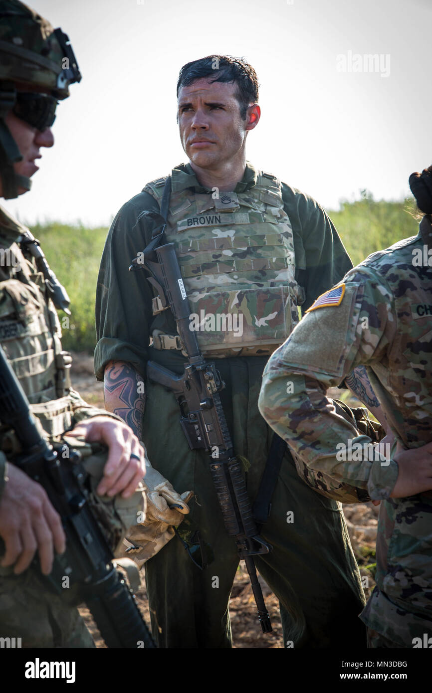 U.S. Army Staff Sgt. Joshua Brown, assigned to the 1st Brigade Combat Team, 10th Mountain Division, rests after the Maintenance Recovery Site event during the Ordnance Crucible at Fort Pickett, Va., Aug. 23, 2017. The U.S. Army Ordnance Crucible is a three-part competition, comprised of the Ammunition Transfer Holding Point, Combat Repair Team, and Explosive Ordnance Disposal, which is designed to test Soldiers’ teamwork and critical thinking skills. (U.S. Army photo by Spc. Abigayle Marks) Stock Photo