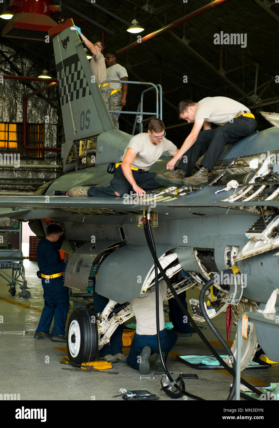 U.S. Air Force maintainers inspect an F16 Fighting Falcon aircraft in