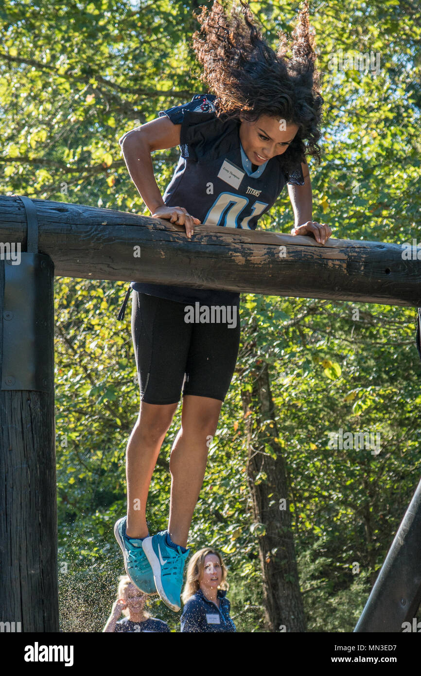 Evony Thompson, Tennessee Titans Cheerleader, leaps over the low belly over obstacle on Fort Campbell on Aug. 24. Women of the Tennessee Titans football team had the opportunity to be a Soldier for a day. (US Army photo by Spc. Patrick Kirby) Stock Photo