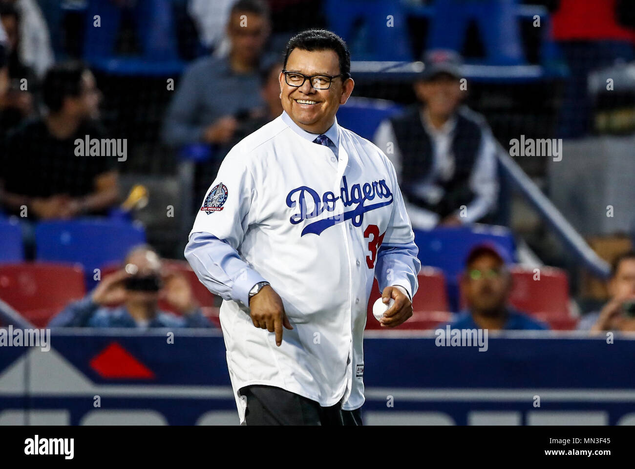 Fernando Valenzuela lanza la primera bola para el playball del partido de beisbol de los Dodgers de Los Angeles contra Padres de San Diego, durante el primer juego de la serie las Ligas Mayores del Beisbol en Monterrey, Mexico el 4 de Mayo 2018. (Photo: Luis Gutierrez) Stock Photo