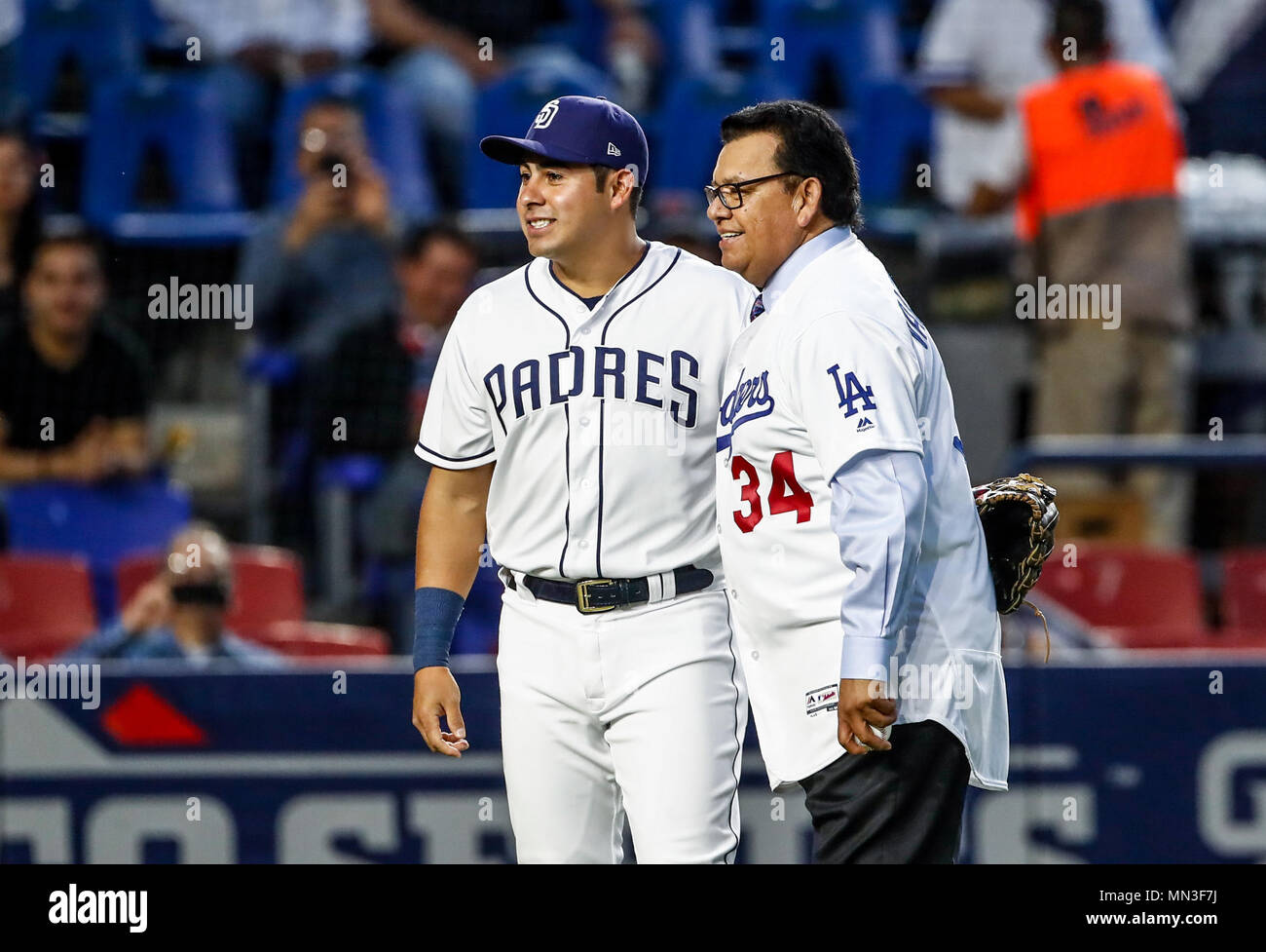 Fernando Valenzuela acompañado de Christian Villanueva,  lanza la primera bola para el playball del partido de beisbol de los Dodgers de Los Angeles contra Padres de San Diego, durante el primer juego de la serie las Ligas Mayores del Beisbol en Monterrey, Mexico el 4 de Mayo 2018. (Photo: Luis Gutierrez) Stock Photo