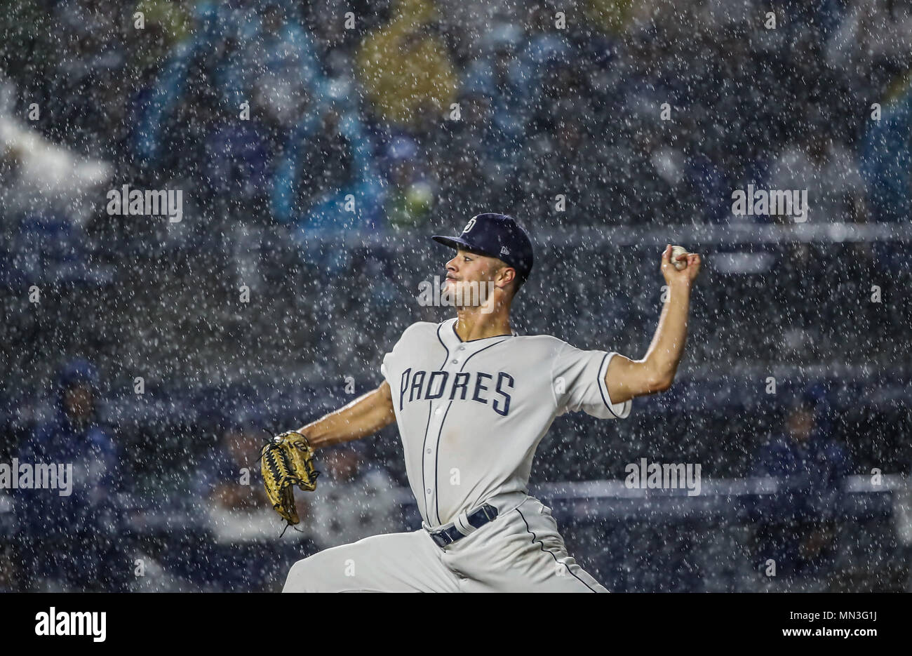 Joey Lucchesi pitcher inicial de San Diego lanza la pelota bajo la intensa lluvia, durante el partido de beisbol de los Dodgers de Los Angeles contra Padres de San Diego, durante el primer juego de la serie las Ligas Mayores del Beisbol en Monterrey, Mexico el 4 de Mayo 2018. (Photo: Luis Gutierrez) Stock Photo