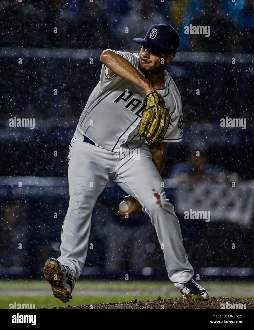 Joey Lucchesi pitcher inicial de San Diego lanza la pelota bajo la intensa lluvia, durante el partido de beisbol de los Dodgers de Los Angeles contra Padres de San Diego, durante el primer juego de la serie las Ligas Mayores del Beisbol en Monterrey, Mexico el 4 de Mayo 2018. (Photo: Luis Gutierrez) Stock Photo