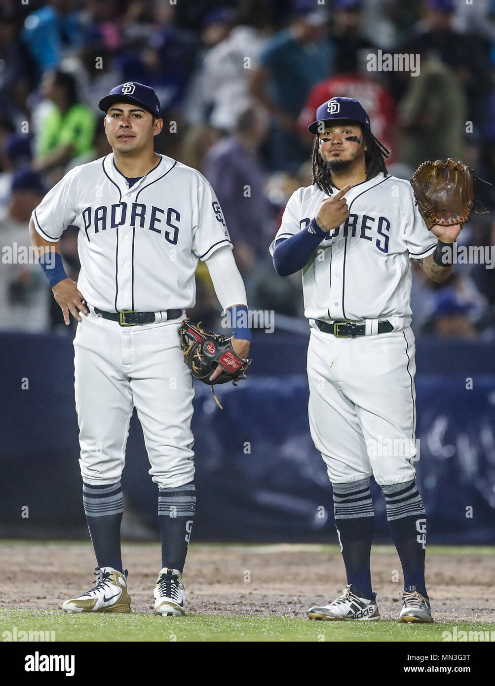 Christian Villanueva y Freddy Galvis de San Diego, durante el partido de beisbol de los Dodgers de Los Angeles contra Padres de San Diego, durante el primer juego de la serie las Ligas Mayores del Beisbol en Monterrey, Mexico el 4 de Mayo 2018. (Photo: Luis Gutierrez) Stock Photo