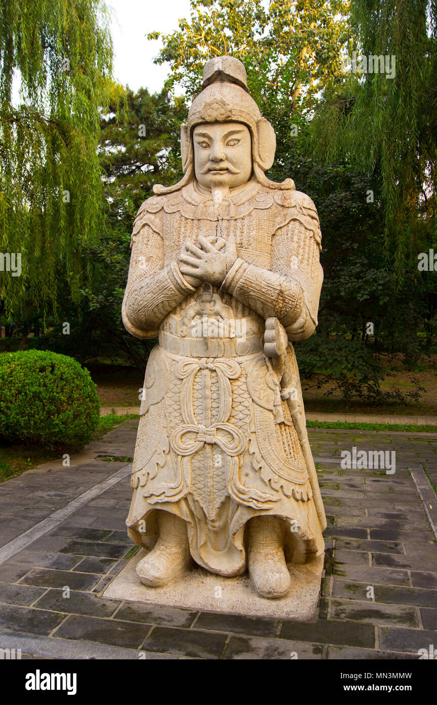 An ornate stonecarved Chinese warrior statue in a park near the Ming Tombs, northwest of